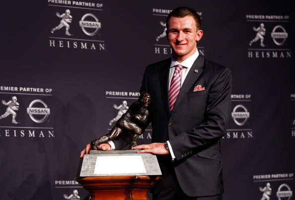 NEW YORK, NY - DECEMBER 08:  Quarterback Johnny Manziel of the Texas A&M University Aggies poses with the Heisman Memorial Trophy after being named the 78th Heisman Memorial Trophy Award winner at a press conference after at the Marriott Marquis on December 8, 2012 in New York City.  (Credit, Mike Stobe/Getty Images)