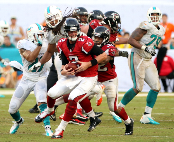 MIAMI GARDENS, FL - SEPTEMBER 22:  Quarterback Matt Ryan #2 of the Atlanta Falcons is under preasure against the Miami Dolphins at Sun Life Stadium on September 22, 2013 in Miami Gardens, Florida. The Dolphins defeated the Falcons 27-23.  (Photo by Marc Serota/Getty Images)