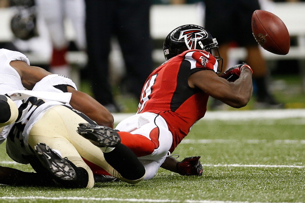NEW ORLEANS, LA - SEPTEMBER 08:  Julio Jones #11 of the Atlanta Falcons fumbles the ball against the New Orleans Saints  at the Mercedes-Benz Superdome on September 8, 2013 in New Orleans, Louisiana.  (Photo by Chris Graythen/Getty Images)