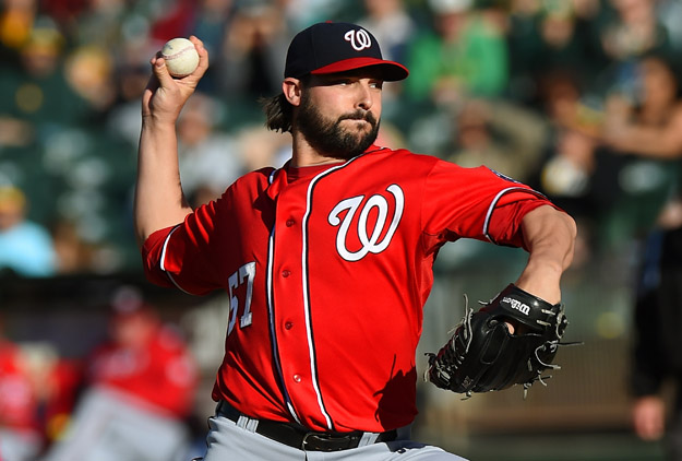 OAKLAND, CA - MAY 10:  Tanner Roark #57 of the Washington Nationals pitches against the Oakland Athletics in the bottom of the first inning at O.co Coliseum on May 10, 2014 in Oakland, California.