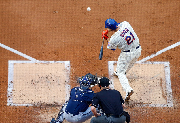 NEW YORK, NY - JULY 09:  Lucas Duda #21 of the New York Mets connects on a first-inning RBI base hit against the Atlanta Braves at Citi Field on July 9, 2014 in the Flushing neighborhood of the Queens borough of New York City.  