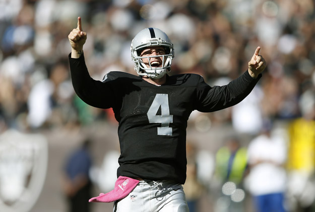 OAKLAND, CA - OCTOBER 12:  Derek Carr #4 of the Oakland Raiders celebrates after throwing a 47-seven-yard touchdown pass against the San Diego Chargers during the third quarter at the O.co Coliseum in Oakland, California. The Chargers won the game 31-28. 