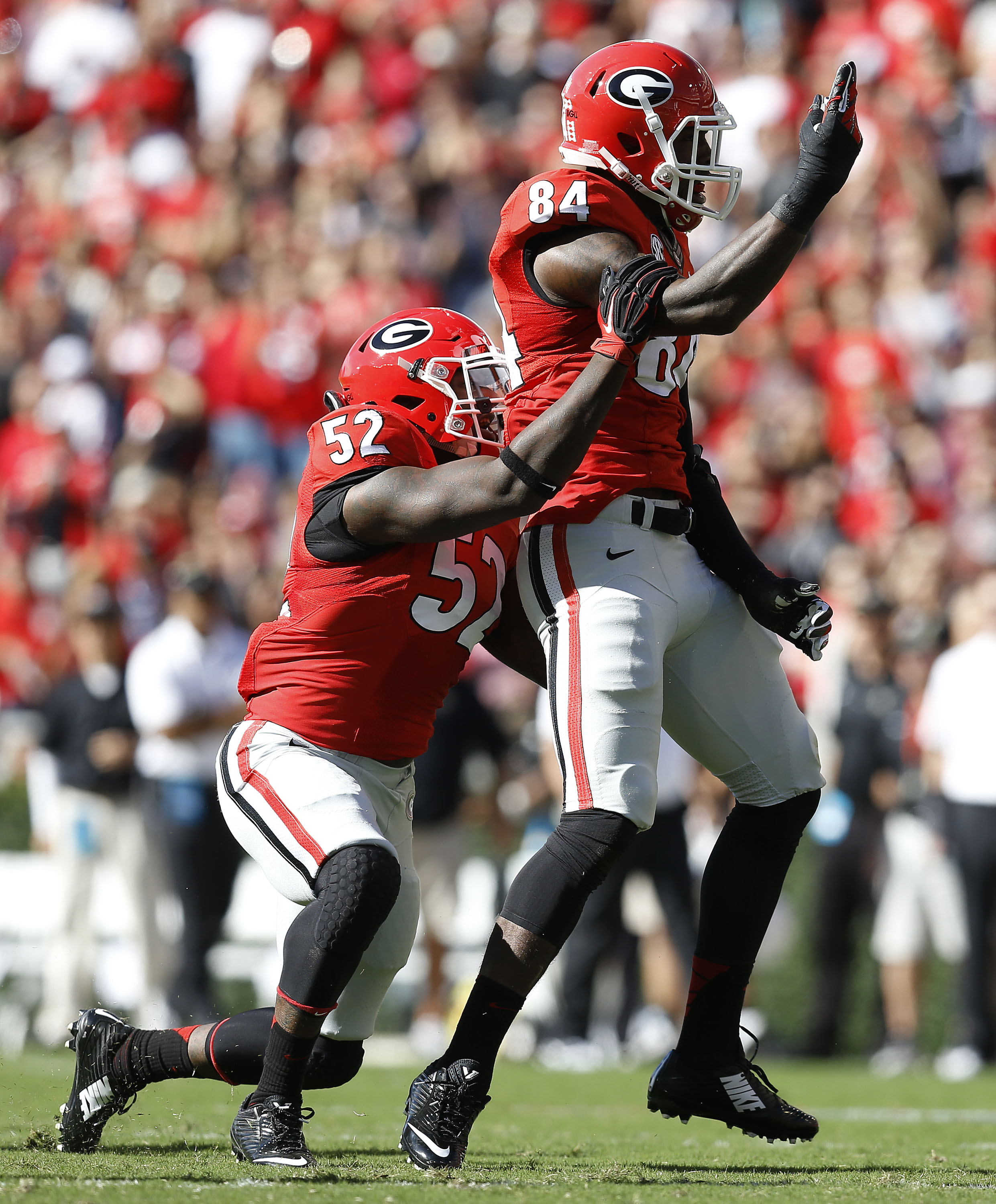 ATHENS, GA - OCTOBER 04:  Linebackers Amarlo Herrera #52 and Leonard Floyd of the Georgia Bulldogs celebrate after a sack during the game against the Vanderbilt Commodores at Sanford Stadium on October 4, 2014 in Athens, Georgia.  (Credit: Mike Zarrilli/Getty Images)