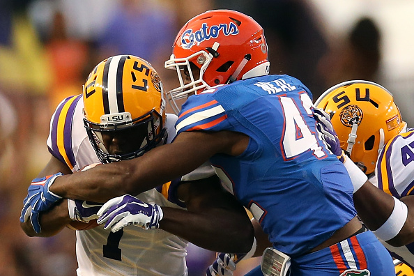 Leonard Fournette #7 of the LSU Tigers is tackled by Keanu Neal #42. (Photo by Chris Graythen/Getty Images)