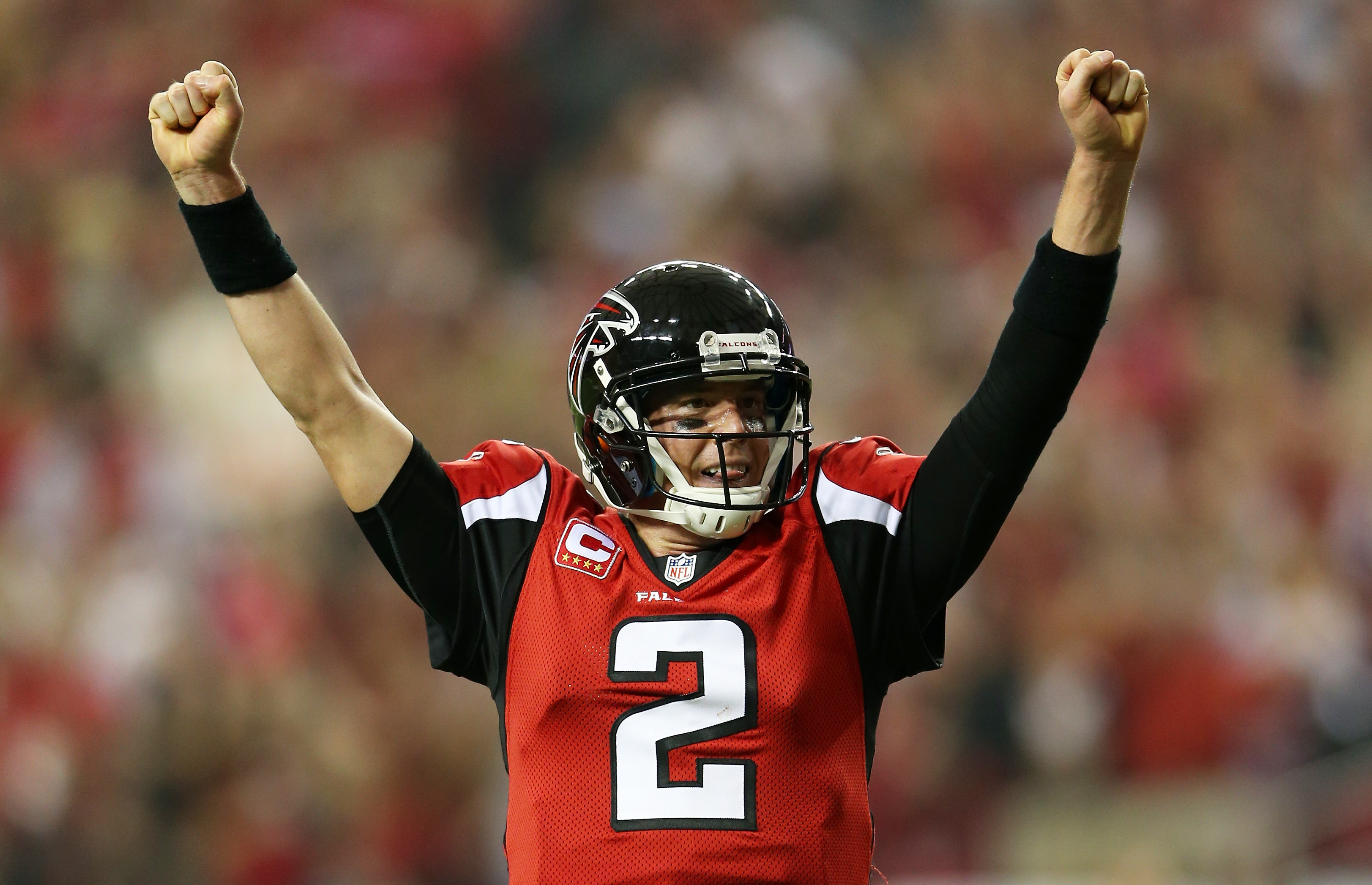 Matt Ryan celebrates a third quarter touchdown pass against the Seattle Seahawks during the NFC Divisional Playoff Game at Georgia Dome in 2013. (Photo by Mike Ehrmann/Getty Images)