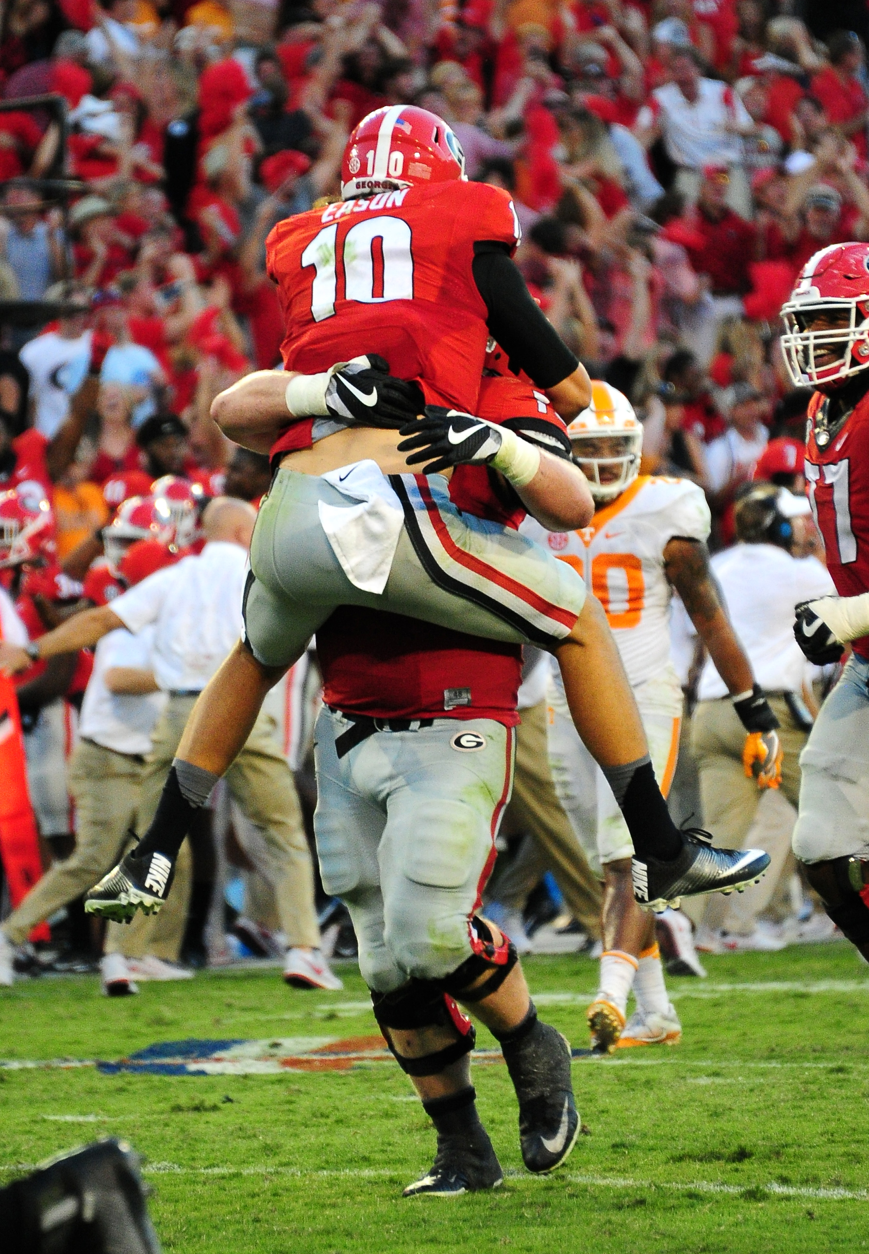 Jacob Eason celebrates with Greg Pyke throwing a fourth quarter touchdown pass against Tennessee (Photo by Scott Cunningham/Getty Images)