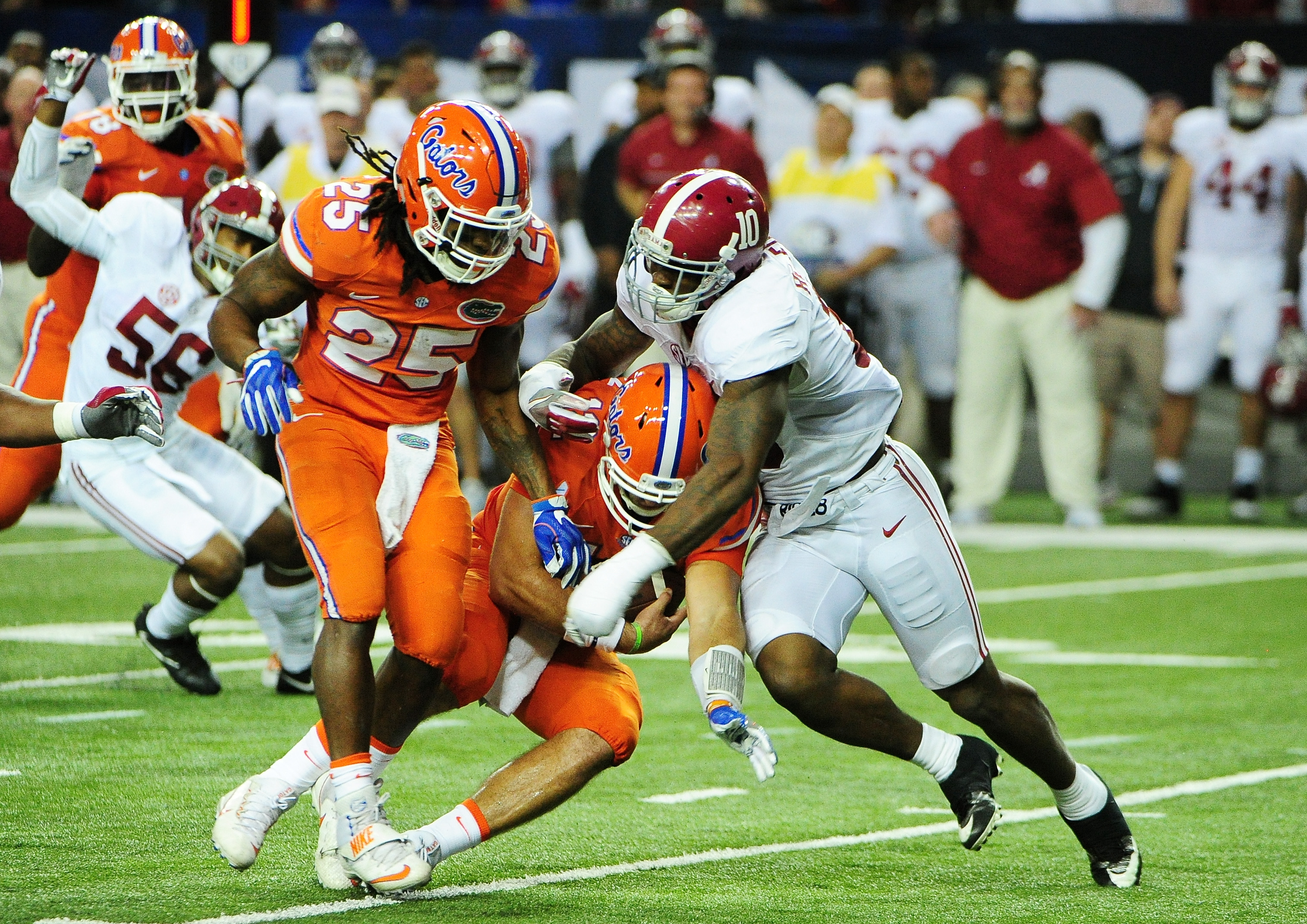 Austin Appleby #12 of the Florida Gators is sacked by game MVP Reuben Foster #10 of the Alabama Crimson Tide in the first quarter during the SEC Championship game. (Photo by Scott Cunningham/Getty Images)